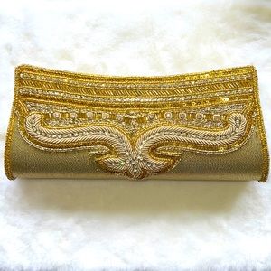 Gold clutch purse with beaded strap
